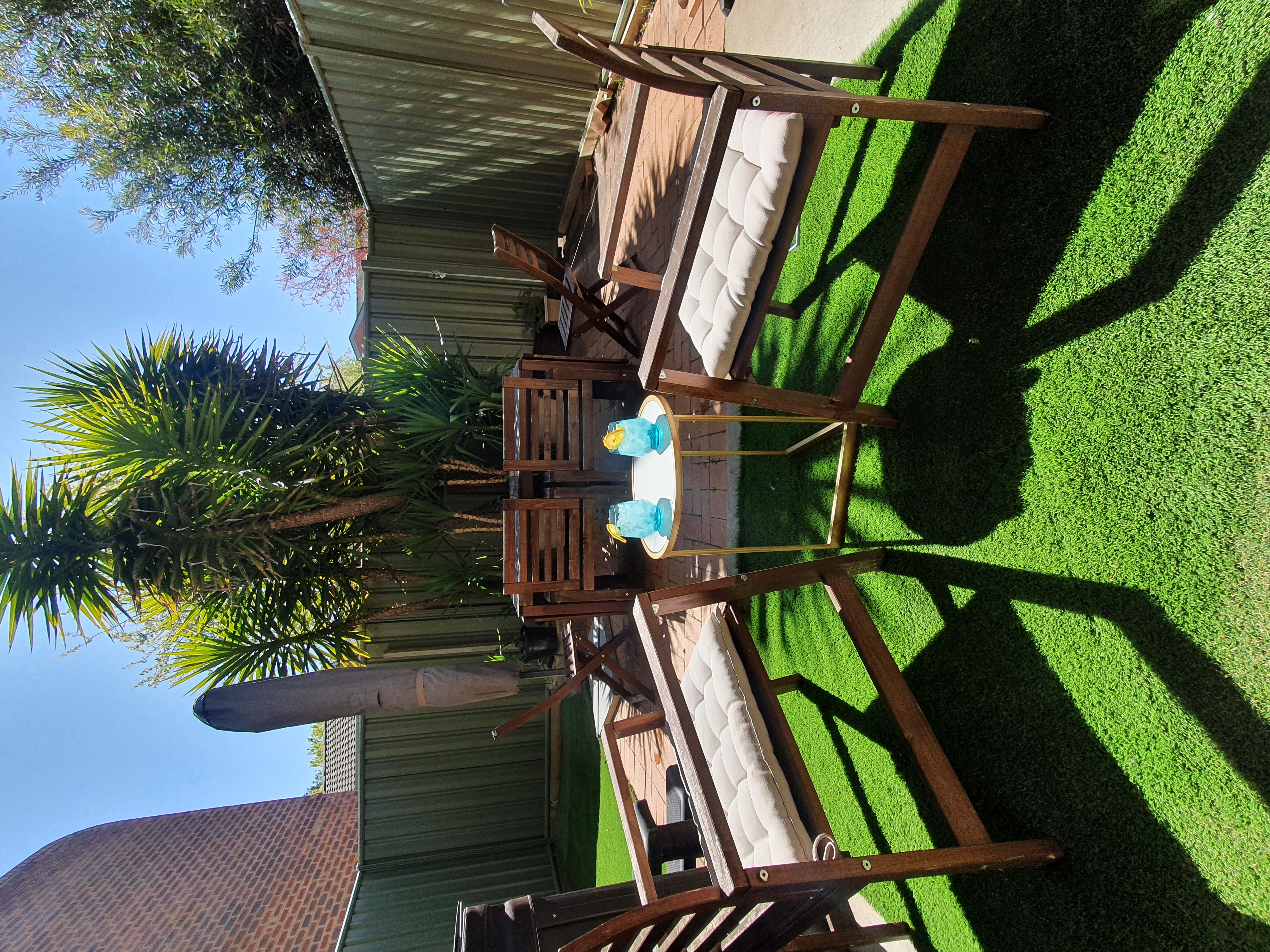 Private outdoor courtyard with seating — perfect for relaxing after a day in Canberra